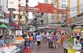 16.08.2017. People, street market stands, shops with colorful advertising and signs and restaurants in one of the streets of China