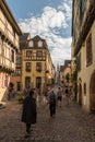 People on street in medieval village of Riquewihr, Alsace, France Royalty Free Stock Photo