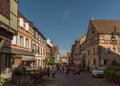 People on street in medieval village of Riquewihr, Alsace, France Royalty Free Stock Photo