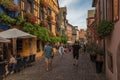 People on street in medieval village of Riquewihr, Alsace, France Royalty Free Stock Photo