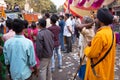 People in the street watching Guru Nanak Gurpurab celebration in