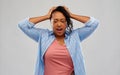 Stressed african american woman holding to head Royalty Free Stock Photo