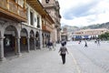 People stroll through the Plaza de Armas of the city of Cusco, Peru Royalty Free Stock Photo