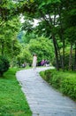 People strolling along quiet path in West Lake Park