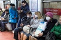 People in the subway in gauze bandages protected against swine flu