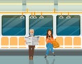 Elderly man reads newspaper and woman listens to music on smartphone in train car in metro Royalty Free Stock Photo
