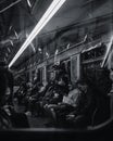 People in subway train. Black and white photo