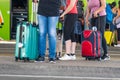 People with suitcases at the bus station