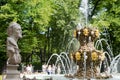 People in The Summer Garden near the fountain and the sculptures. St Petersburg. Russia