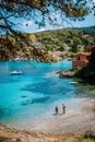 People on summer holiday on beautiful idyllic beach in Kefalonia island of Greece - Europe