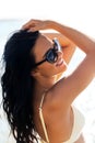 smiling young woman in bikini swimsuit on beach Royalty Free Stock Photo