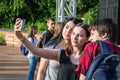 People on the summer terrace take photos