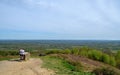 People at the summit of Holmbury Hill, Surrey, UK