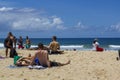 People sunbathe at beach