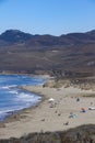 People on a sunny beach of a hidden cove