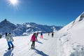 people on sunny slope at 3 valleys ski resort in Alps