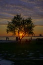 People and sunset on the beach.