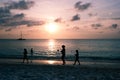 People at sunset on Palm Beach, Aruba Royalty Free Stock Photo