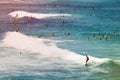 People surfing at the crowded Bondi beach in Sydney, Australia