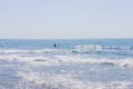 People surfing in the oean in a sunny day Royalty Free Stock Photo