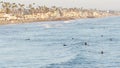 People surfing, surfers swimming in water and waiting sea wave, Oceanside, California USA Royalty Free Stock Photo