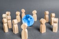 People surrounded a Globe world planet earth. Cooperation and collaboration of people around the world. Outsourcing and joint work Royalty Free Stock Photo