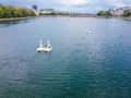 People swim in boats in the shape of a swan. Copenhagen, Denmark. Aerial view from the top. tourist popular must visited