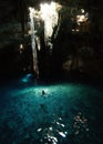 People swim in a cenote