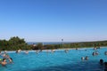 People swim in the outdoor pools against the backdrop of the picturesque scenery of the ski resort in the summer. Russia, Royalty Free Stock Photo