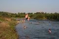 People swim in the river