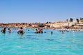 People swim in the sea at the resort. Panoramic view of the beach at Club Fanara.