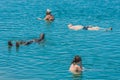 People swimming bathing in dead sea jordan