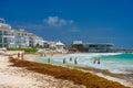 People swimming on the beach near hotel in Playa del Carmen, Mexico