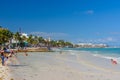 People swimming on the beach near hotel in Playa del Carmen, Mexico