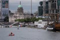 People swimming in the River Liffey, Dublin, Ireland during the annual Liffey Swim