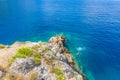 Clear crystal turquoise waters in a rocky bay in Assos village of Kefalonia, Greece