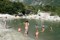 People swimming and sunbathing on maggia river at Ponte Brolla
