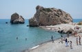 People swimming and walking at of the Rock of Aphrodite beach,