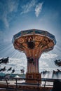 People swinging on a swing ride at a county fair and carnival Royalty Free Stock Photo