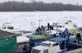 People take out trapped boat from the frozen Danube river