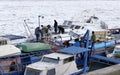 People take out trapped boat from the frozen Danube river