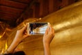 Bangkok, Thailand-January 16,2016:People take a photo Reclining Buddha statue in the Wat Pho temple