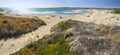 People take sun bath on the beach located near Sampieri town, Sicily. Royalty Free Stock Photo