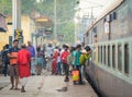 People take the train at station in Delhi, India