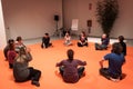 People taking a class of body awareness at Olis Festival in Milan, Italy