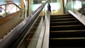 People taking escalator inside YVR airport
