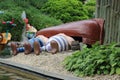 People taking a nap under the boat dolls from Epidemais Croisiere attraction at Park Asterix, Ile de France, France Royalty Free Stock Photo