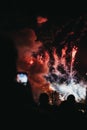 People taking photo of fireworks on mobile phone during Guy Fawkes Night yearly celebration in Alexandra Palace, London, UK..