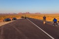 People taking photo on Forrest Gump Point at US Highway 163 toward Monument Valley Navajo Tribal Park. Royalty Free Stock Photo