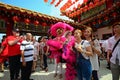 People taking photo with lion dancer